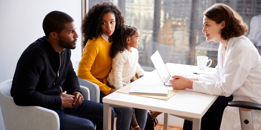 Patient family consulting with doctor