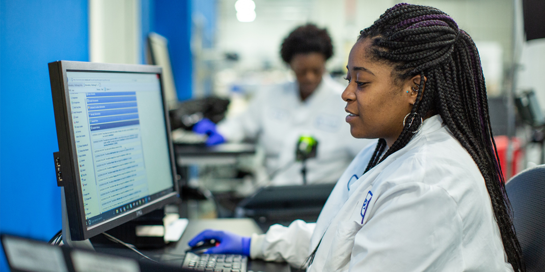 Scientist analyzing data on computer