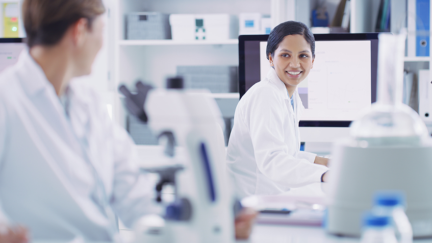 Shot of a scientist working alongside a colleague in a lab